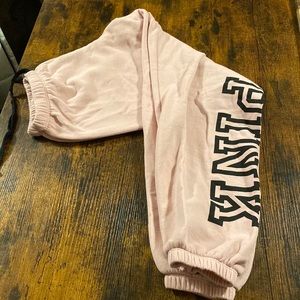 PINK sweatpants.Light pink with draw string and black PINK logo on the left leg.